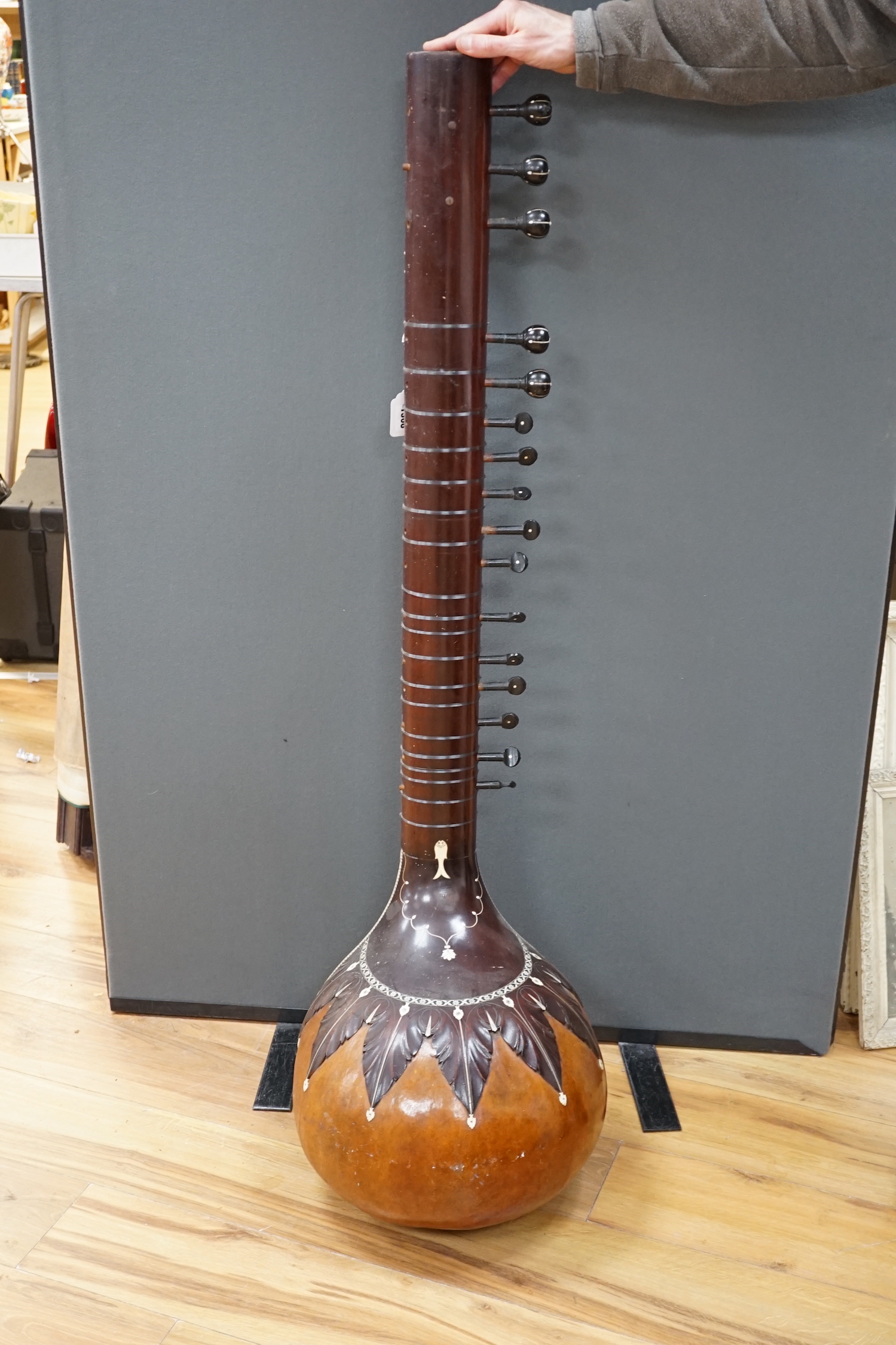 An Indian sitar, with ivory bridge and decoration, inlaid with ‘Harbhajan Grewal’ overall length 129cm CITES Submission reference LA16A6BD